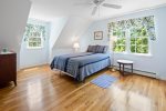 Queen bed in large second story bedroom